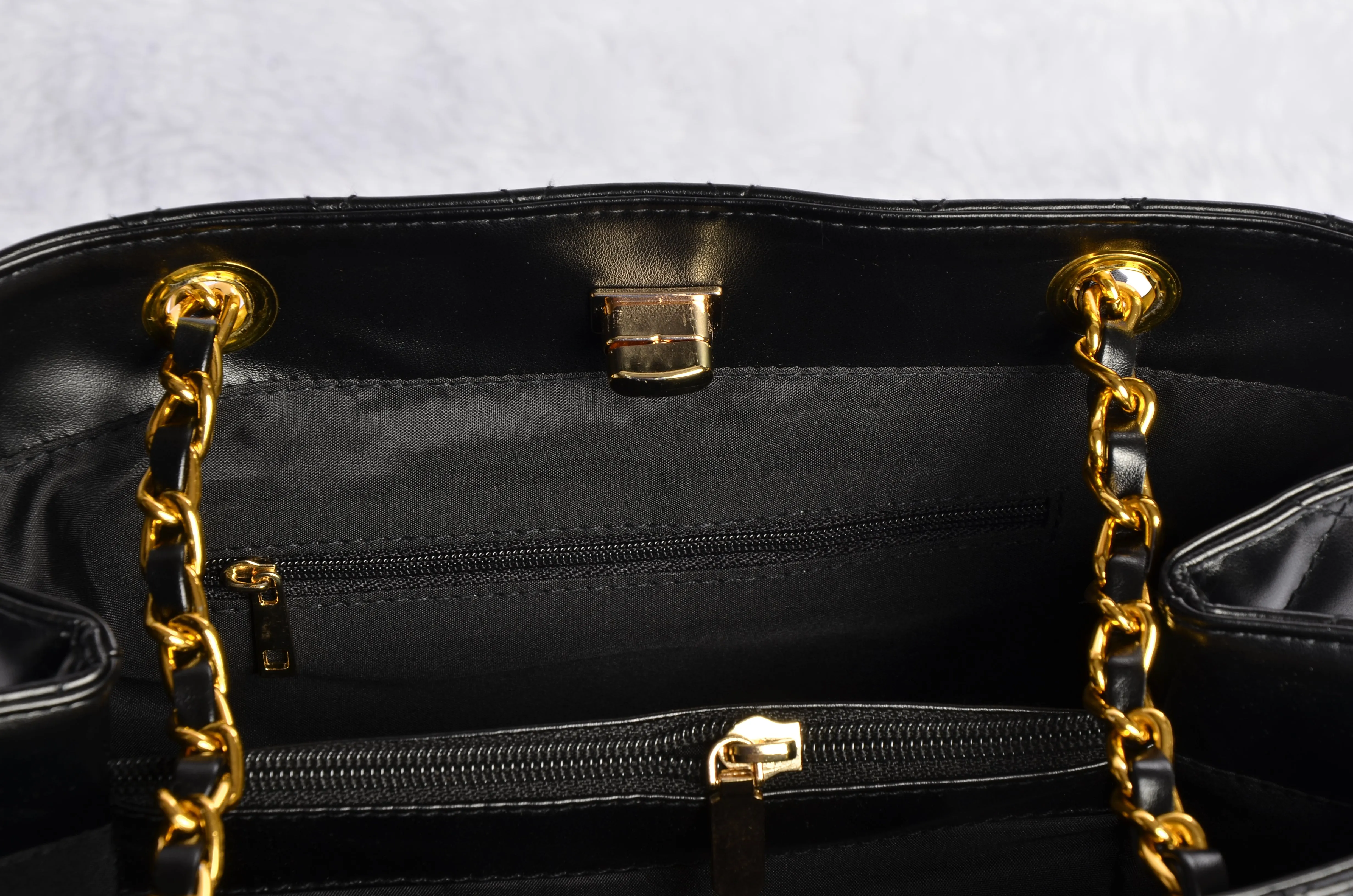 Stylish handbag with gold chain strap