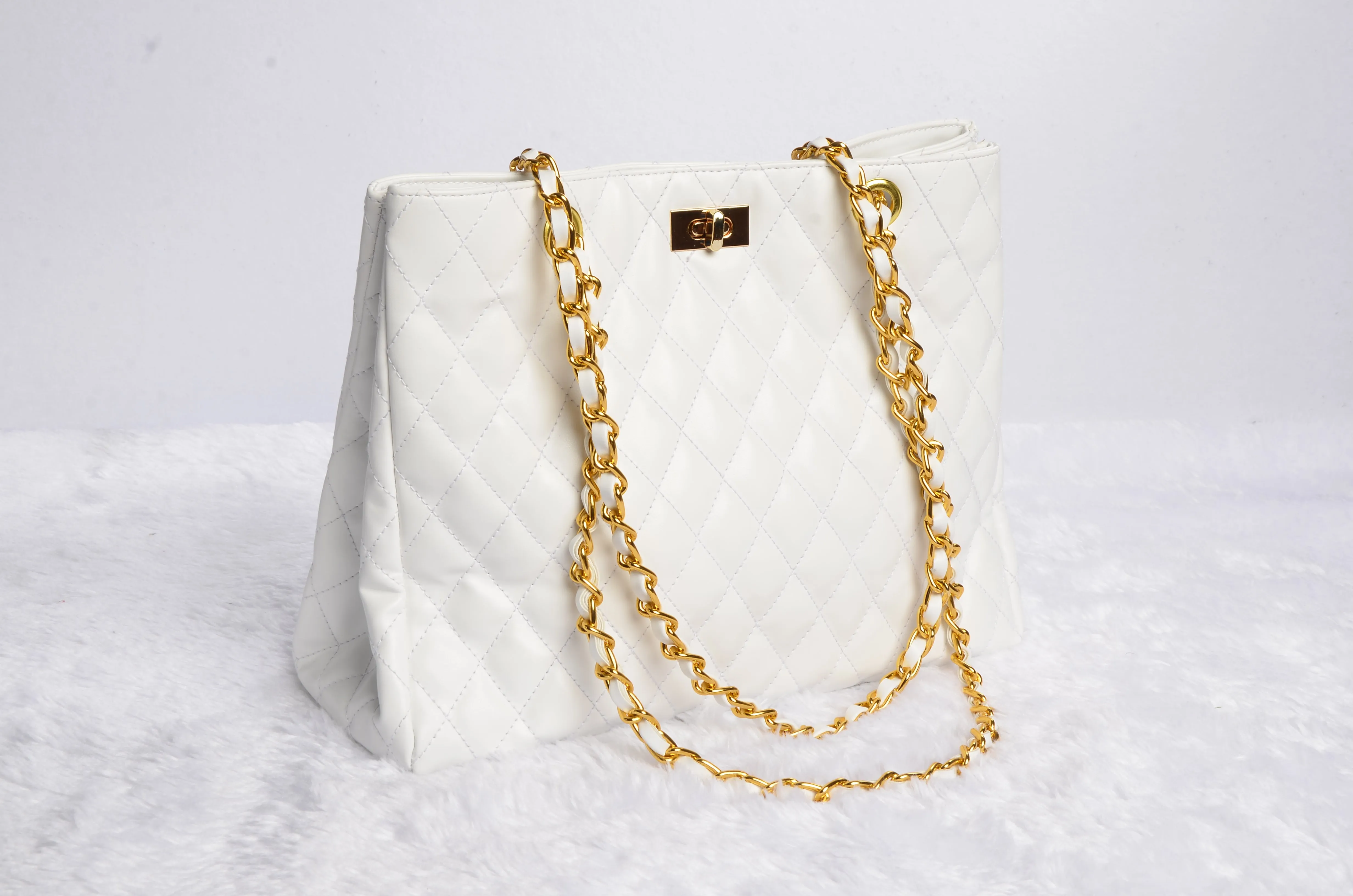 Stylish handbag with gold chain strap