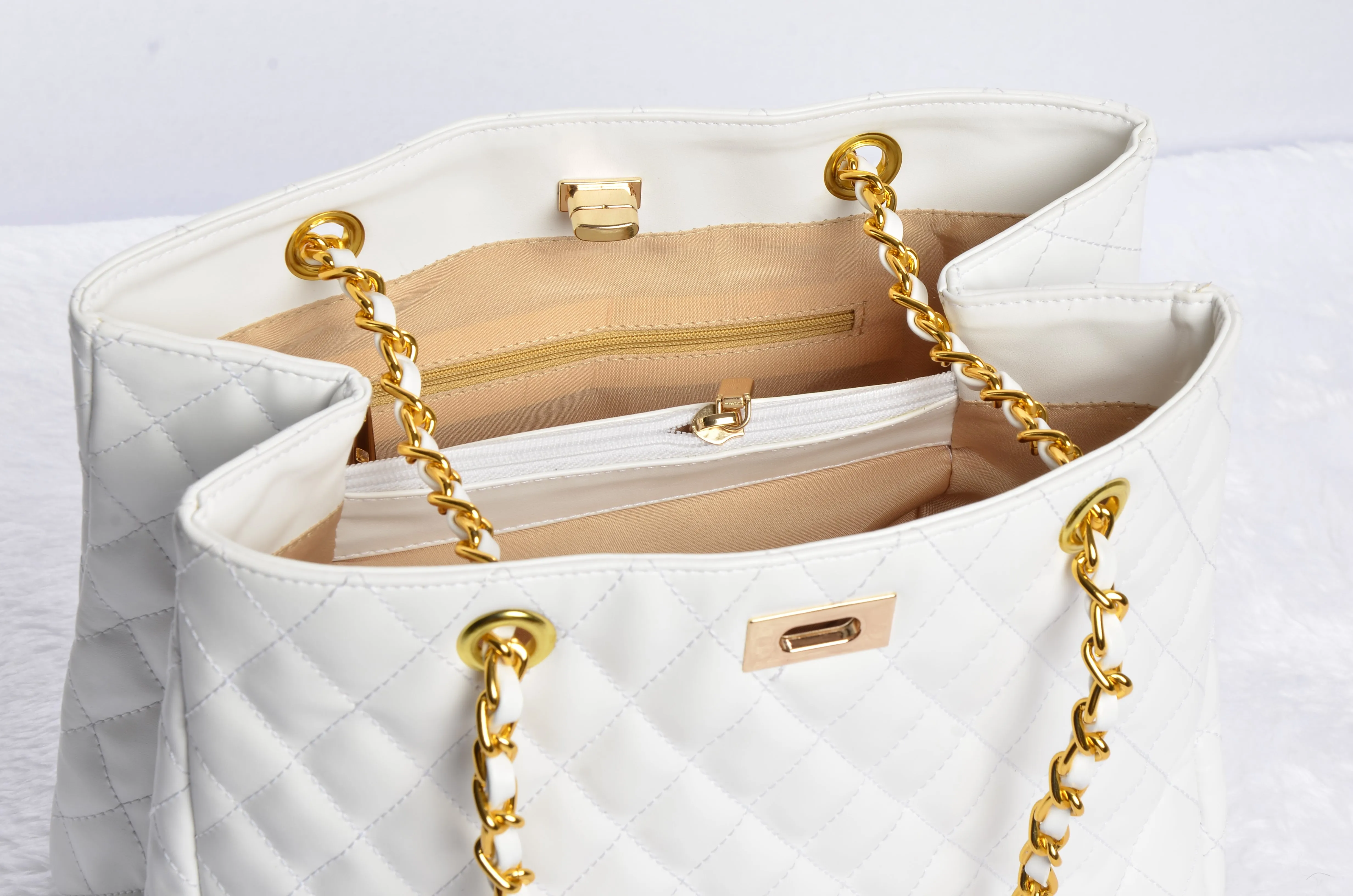 Stylish handbag with gold chain strap