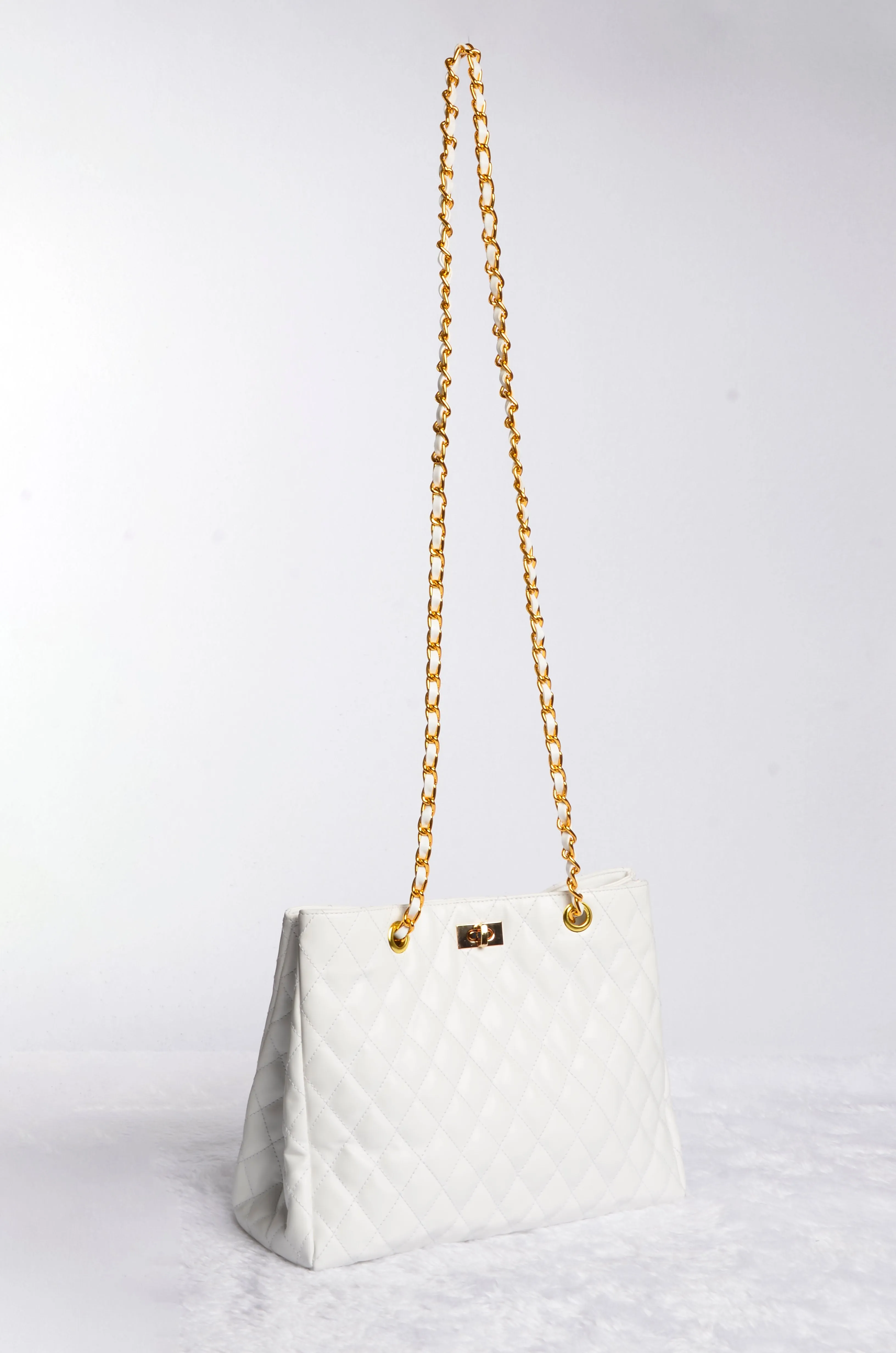 Stylish handbag with gold chain strap