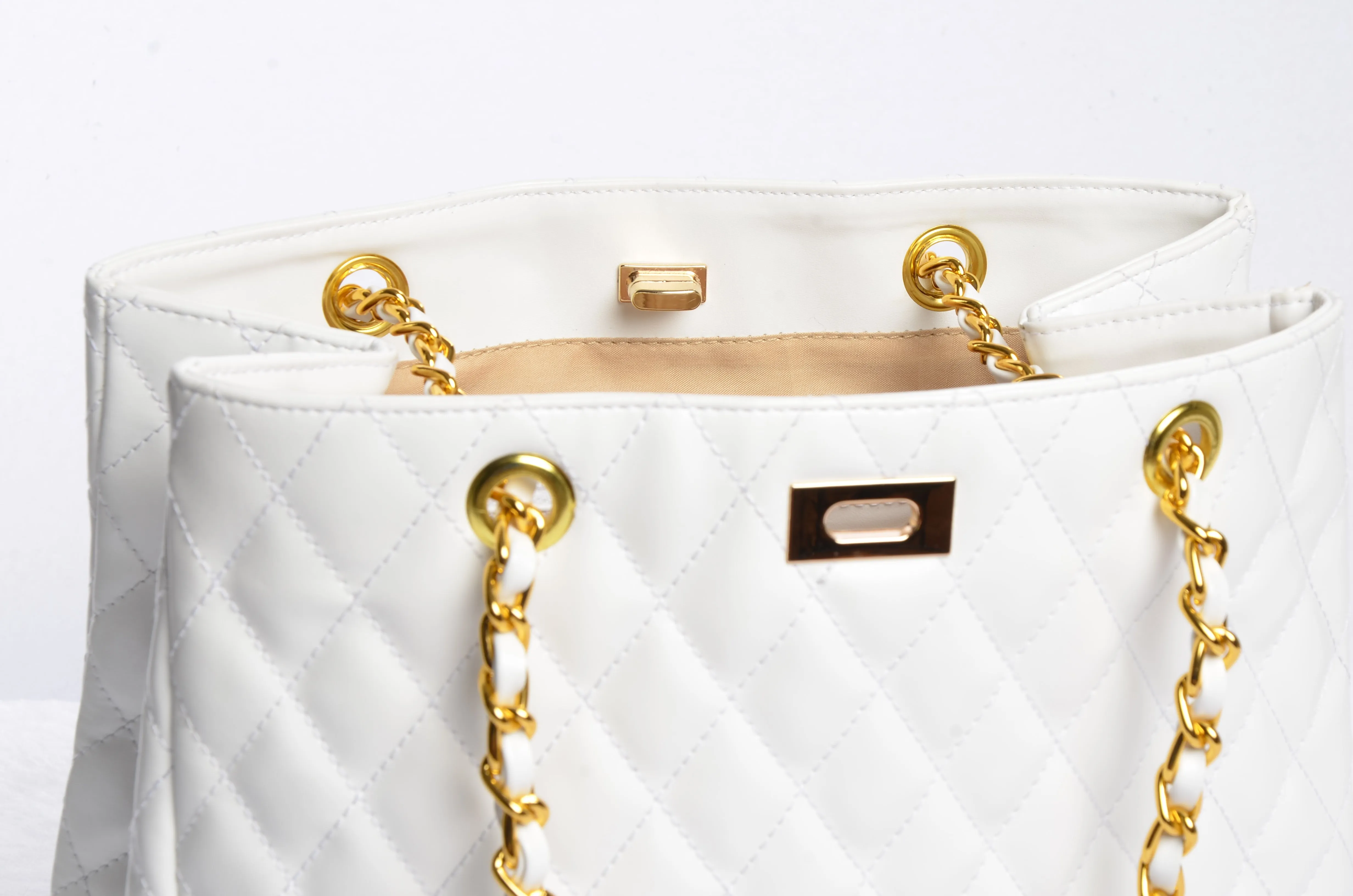 Stylish handbag with gold chain strap