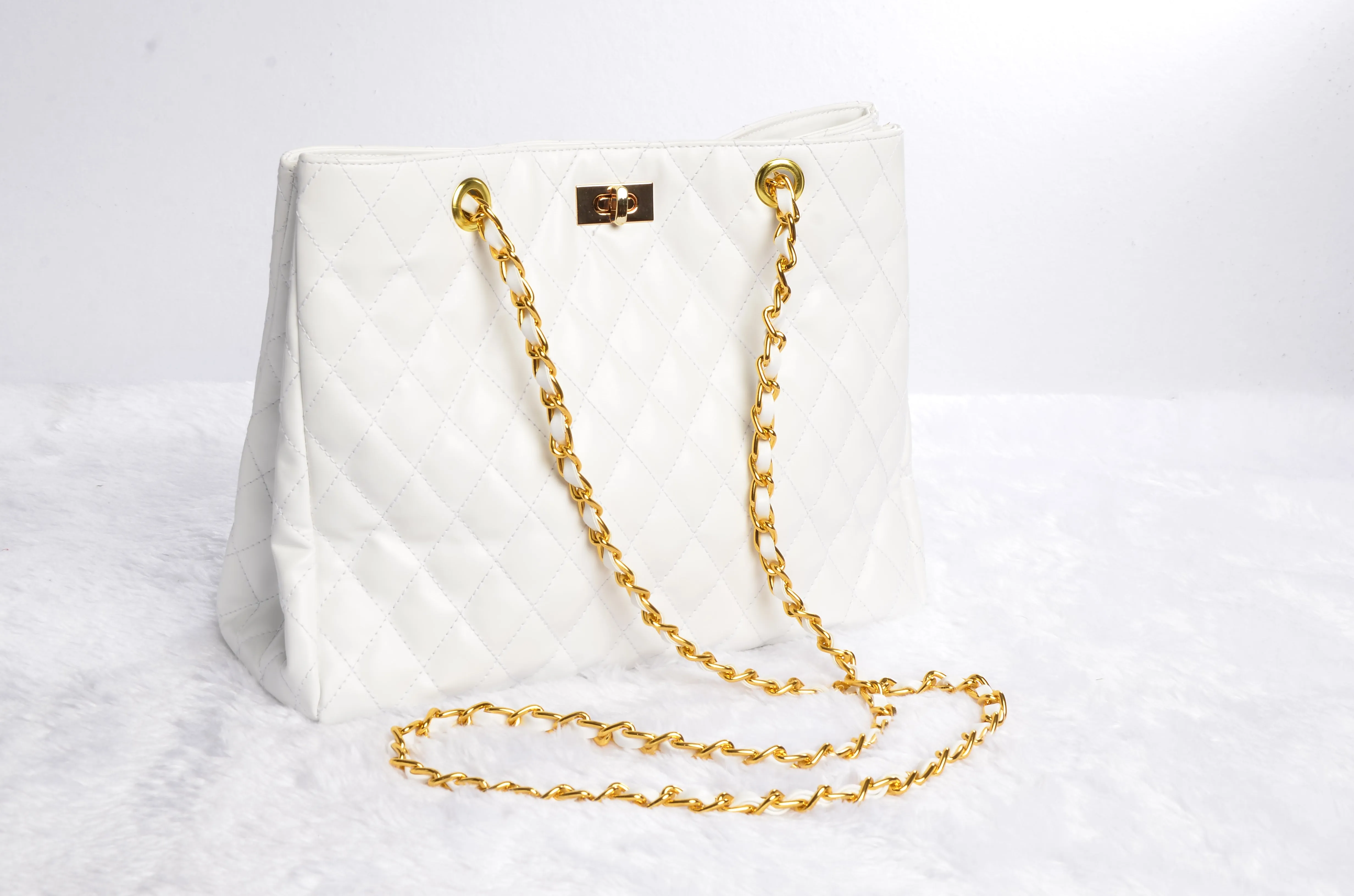 Stylish handbag with gold chain strap