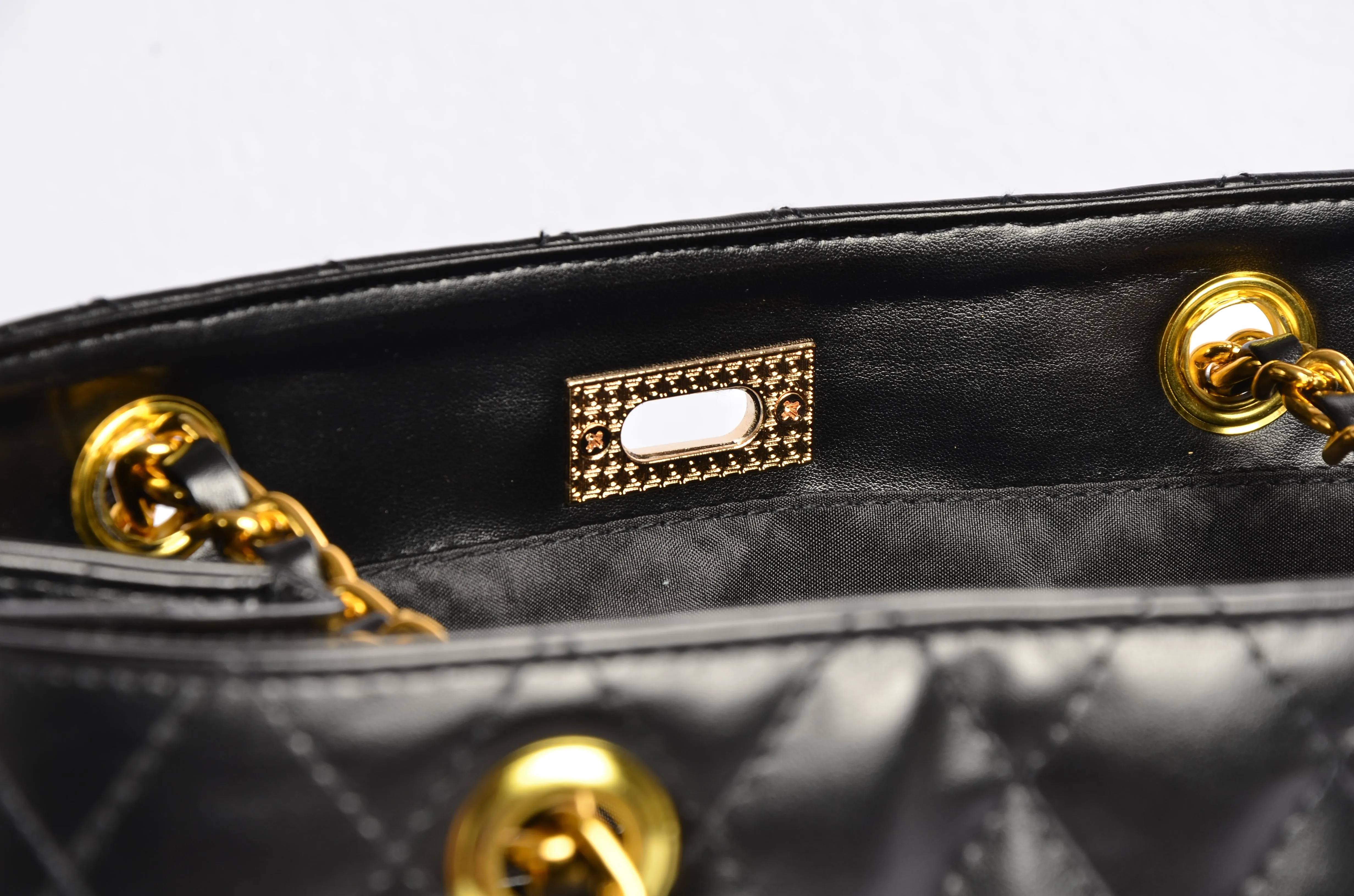 Stylish handbag with gold chain strap
